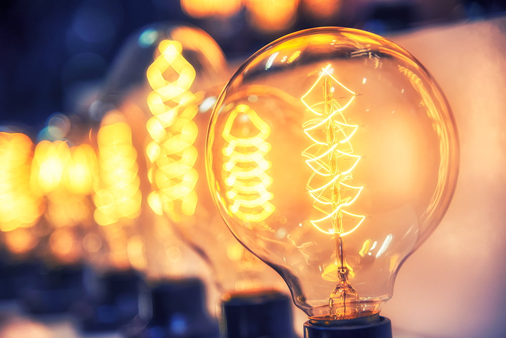 Close up of light bulb and the intricate support wires and filament