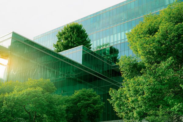 glass building surrounded by trees
