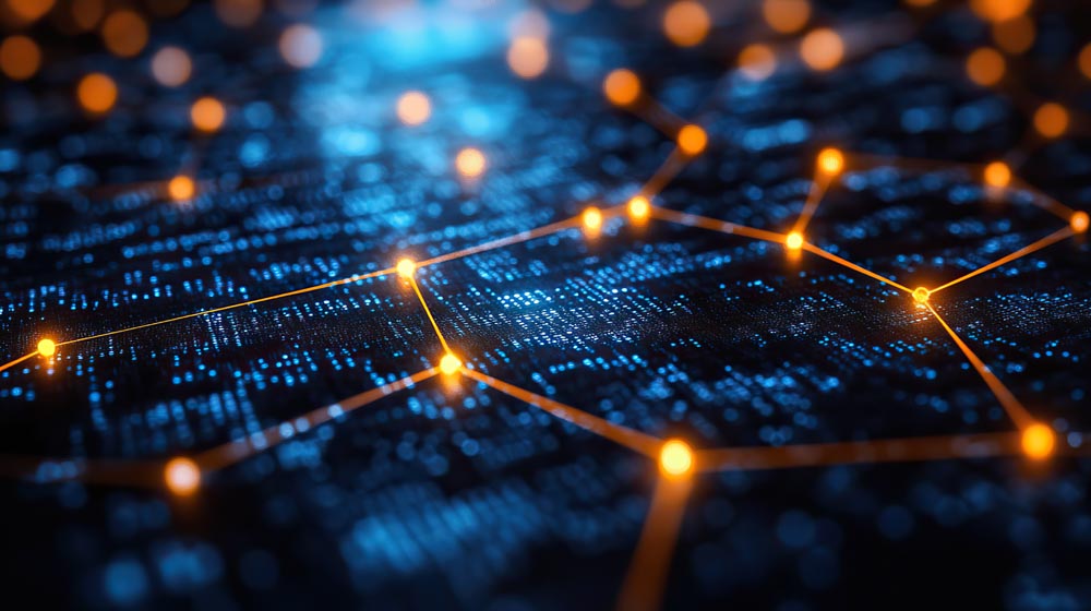 Glowing points joined together against a dark surface. (Source AdobeStock.)