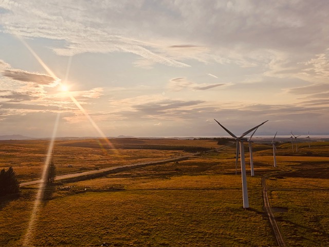 Wind turbines at sunset. Image by Katie Brumwell.